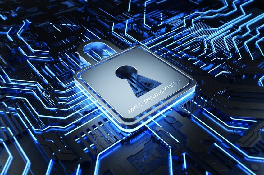 A padlock on a circuit board featuring MCC objectives.