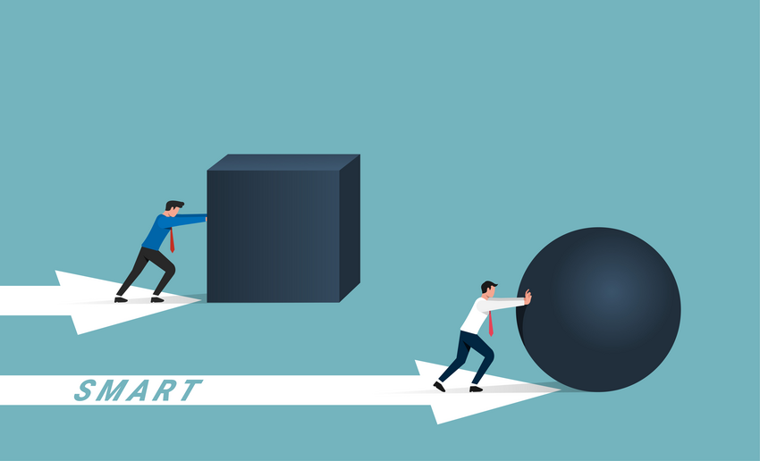 Two medical students using vector force to push a big ball in the opposite direction.