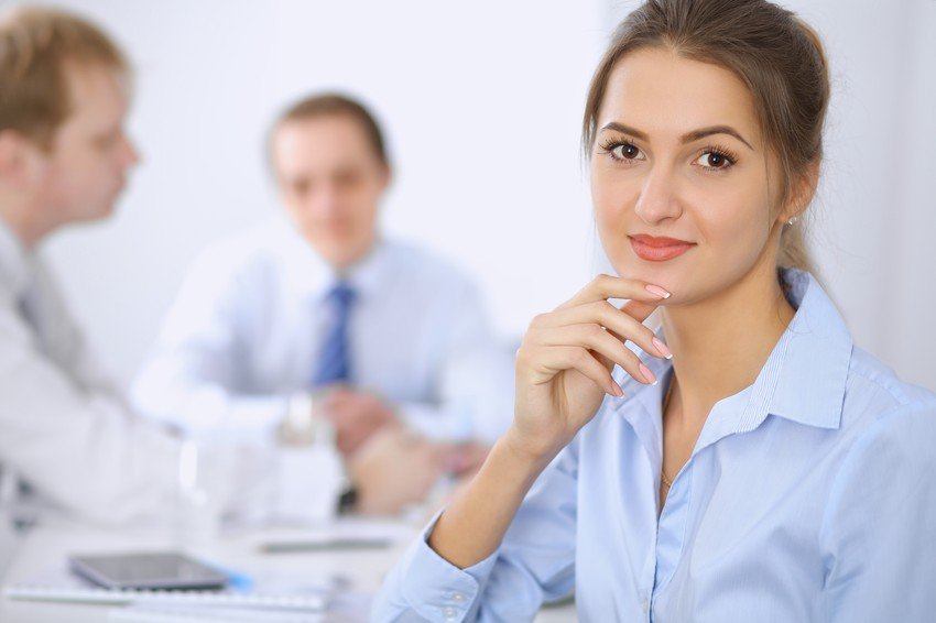 A woman is contemplating at her desk whether to leave any discipline for the MCCQE1 exam or not.