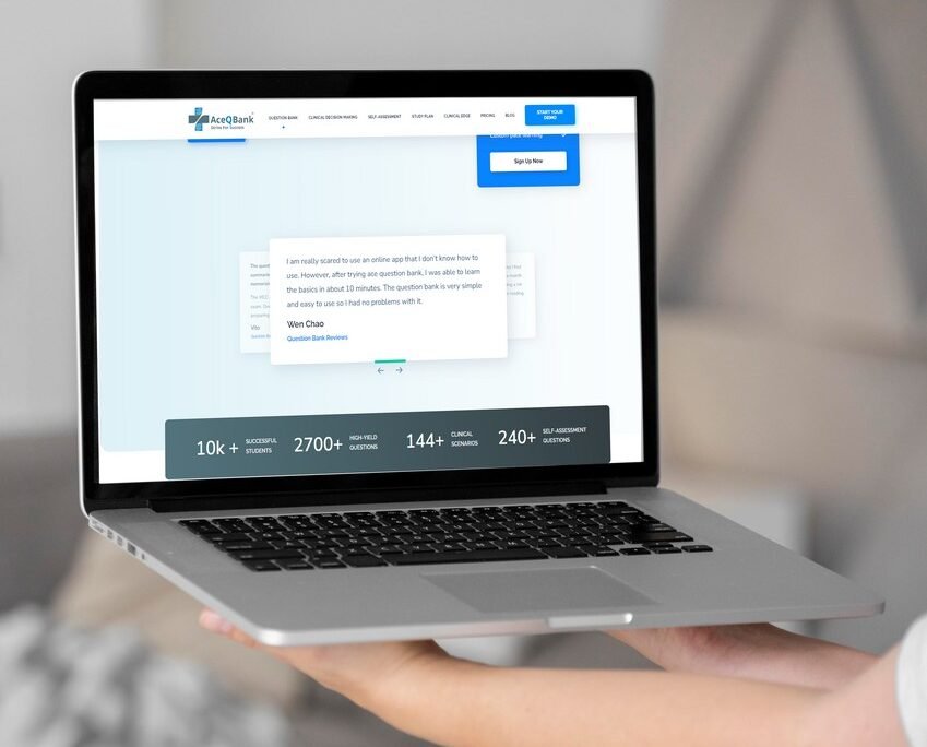 The person holding a laptop displaying the Ace QBank website with testimonials related to MCCQE1 exam preparation.