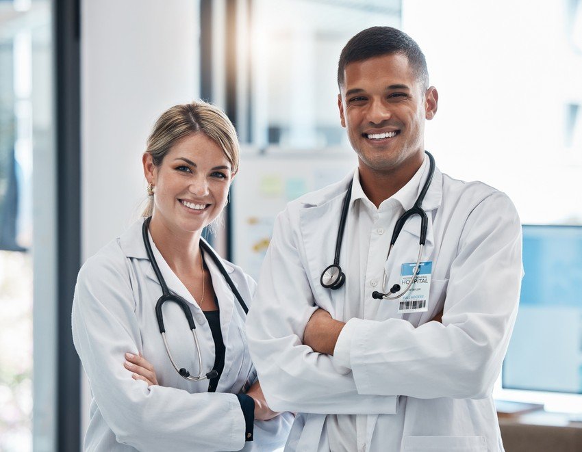 Two IMG doctors posing for a photo after an MCCQE1 exam preparation question bank review session.