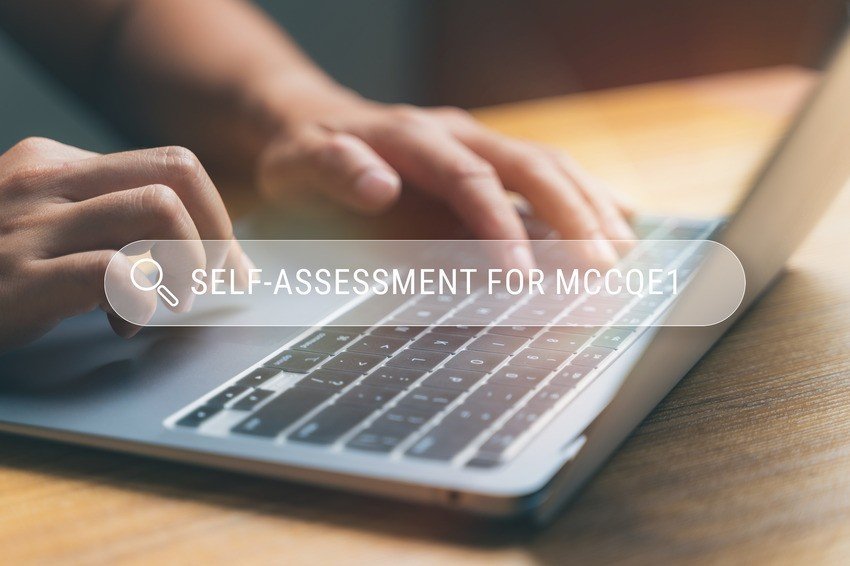 Person typing on a laptop with a transparent overlay text - Self-assessment and MCCQE Part 1 scheduling 2025.