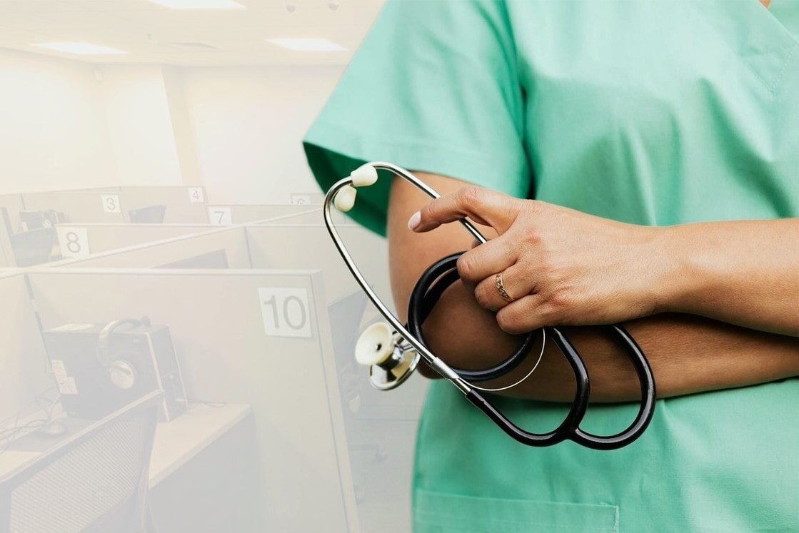 A person in green medical scrubs holds a stethoscope in front of a row of numbered office cubicles, symbolizing the focus and professionalism needed for MCCQE1 Exam Prep with Ace QBank.