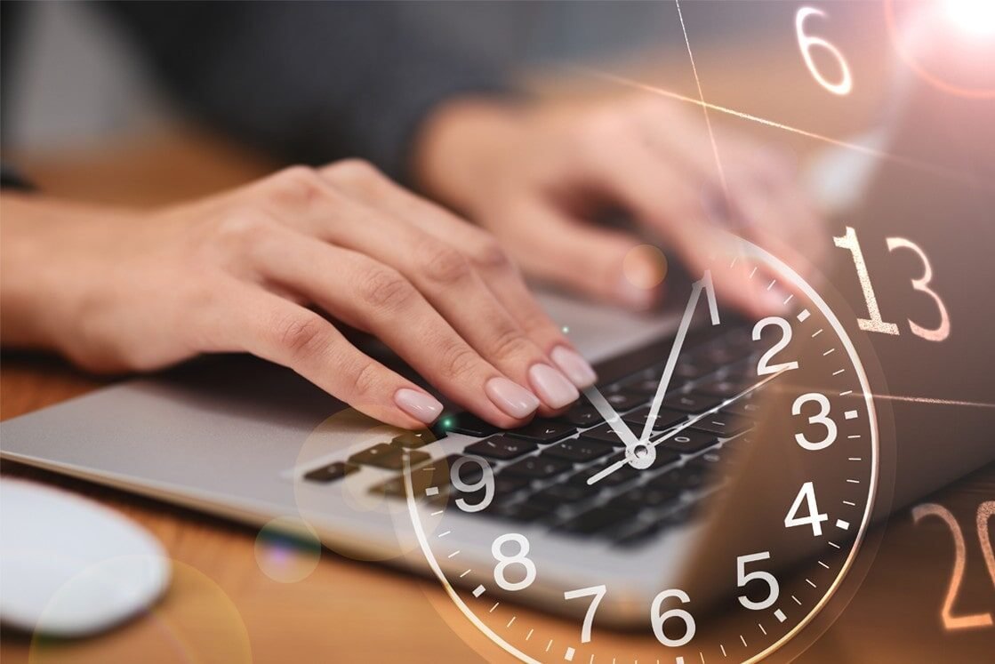 Hands typing on a laptop keyboard with a transparent overlay of a clock, symbolizing MCCQE1 exam preparation or working against the deadline to review MCCQE1 Exam Dates using Ace QBank.