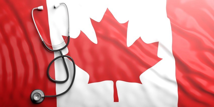 A stethoscope lying on a Canadian flag symbolizes healthcare in Canada and the journey of MCCQE1 exam prep.