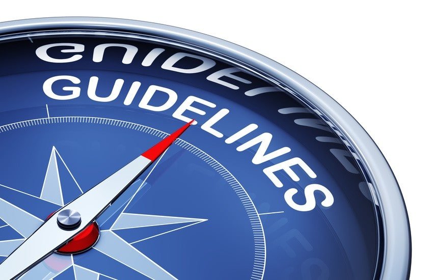 A close-up of a blue compass with the word "GUIDELINES" prominently displayed, symbolizing direction and guidance for Ace QBank users during their MCCQE1 exam preparation.