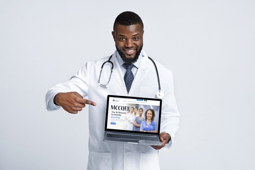 A male doctor in a white coat and stethoscope smiles while pointing to a laptop displaying the Ace QBank website, inspiring motivation for anyone preparing for the MCCQE1 exam.